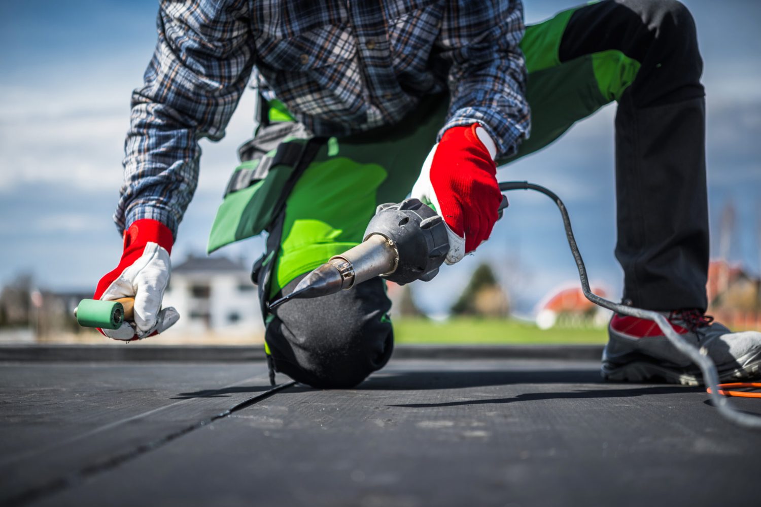 EPDM Membrane Installation Using Hot Air Blower. Ethylene Propylene Diene Terpolymer Material. Roofing Technologies.